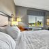 Hampton Inn Buffalo - Amherst guest room with king bed and window view in Amherst