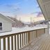 Tromsø Lodge & Camping in Tromsø, snowy cabin porch with mountain views and wooden deck
