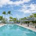 The Capitana Key West poolside oasis with palm trees and lounge chairs in Key West