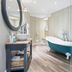 Greenbank Hotel, Falmouth: spa bathroom with freestanding teal tub and glass shower