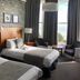 West Rocks Townhouse, Eastbourne: twin beds, bay window with sea view, and seating area