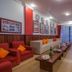 Mekong Angkor Palace Hotel in Siem Reap lounge with red armchairs, coffee tables, and large windows