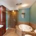The Giacomo, an Ascend Collection Hotel bathroom with glass shower and corner soaking tub in Niagara Falls