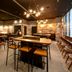 Just Sleep Osaka Shinsaibashi lounge with bar seating, warm lighting, and large windows in Osaka