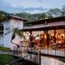 CC Beach Front Hotel in Playa Hermosa with open-air dining terrace and lush tropical surroundings
