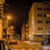 City Hotel Mercator in Frankfurt am Main on a night street view with lit exterior and parked cars