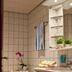 Hotel Neuer Karlshof bathroom in Baden-Baden with tiled tub, vanity sink, towels, and orchid