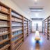 Kumano No Yado Umihikari in Kumano, manga library with long shelves and central bench