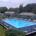 Village Green Motel in South Yarmouth with outdoor pool and lounge chairs
