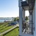 Kurort Stara Wedzarnia in Gdansk with balcony view of waterfront lawn and parked cars