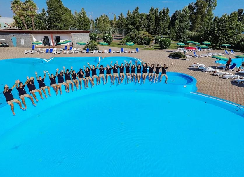 Resort Itaca - Nausicaa in Rossano: large outdoor pool with guests posing and sun loungers nearby