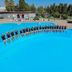 Resort Itaca - Nausicaa in Rossano: large outdoor pool with guests posing and sun loungers nearby