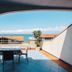 Oasi Azzurra terrace with table, chairs and sea view in Villafranca Tirrena