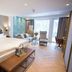 Hotel Jagdhaus Wiese in Schmallenberg guest room with double bed, seating area and balcony doors