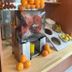 Deltour Hotel Le Puy En Velay breakfast area with orange juicer, fruit, cups and tea packets in Le-Puy-en-Velay