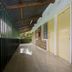 Balis Best Bar and Resort Nairobi covered corridor with tiled floor and guest room doors