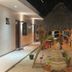 Hotel San Julio in Celestún courtyard with thatched palapa, sand walkway, and flamingo decor