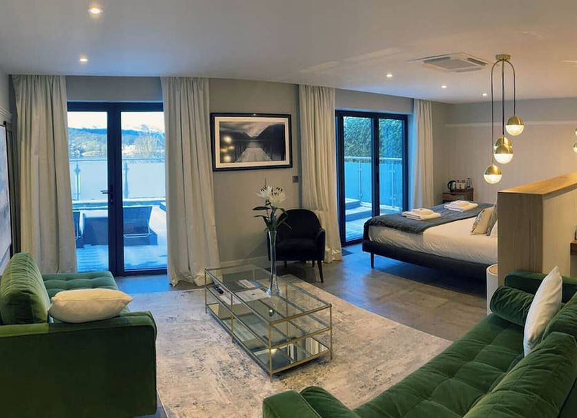 Beech Hill Hotel & Spa, Windermere: suite with lake-view balcony, king bed, and green sofa seating