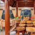 Somadevi Angkor Premium in Siem Reap breakfast buffet in a wooden dining pavilion with breads and pastries
