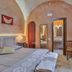 Masseria Casina Vitale in Ceglie Messapica room with arched stone ceiling and ensuite bathroom