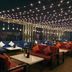 Royal Orchid Central Jaipur, Bani Park rooftop lounge with string lights and seating
