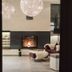 Post Hotel - Tradition & Lifestyle Adults Only lobby lounge with fireplace and hanging globe lights in San Candido