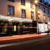 Dillons Hotel in Letterkenny, lit exterior at dusk on a street with light trails