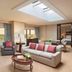 The Westin Southfield Detroit suite with skylight, seating area, and city views in Southfield