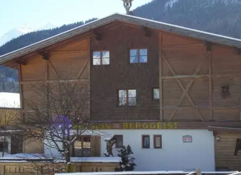 Pension Berggeist in Sölden, alpine lodge exterior with snowy mountain backdrop