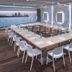 Hotel Alhambra in Santa Susanna meeting room with U-shaped conference table and city mural