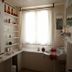 La Demeure Saint-Ours in Loches: bright bathroom with window, built-in tub, and wall-mounted sink