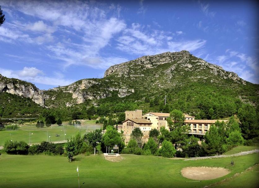 Domus Selecta La Figuerola Resort And Spa in Vandellos with mountain views, golf course and resort buildings