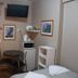 Westside Studio Apartments in Armidale with compact studio room, TV, microwave, table and chair