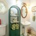 Sea Cliff Gardens Bed & Breakfast in Port Angeles bathroom with pedestal sink, green shelving, and stained-glass window