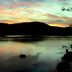 Bay of Many Coves in Picton with sunset over a calm bay and silhouetted hills