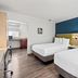 SureStay by Best Western Santa Monica guest room with two beds and adjoining kitchenette
