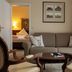 Hotel Weisses Haus in Bad Kissingen suite with sofa, armchairs and a bedroom doorway