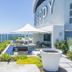 Rhapsody Resort in Surfers Paradise rooftop terrace with ocean views, lounge seating, and fire pit