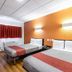Motel 6 Elizabeth NJ Newark Liberty Intl Airport room with two beds and orange accent wall