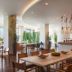 Akra V Hotel Antalya dining room with sea view, floor-to-ceiling windows and modern tables