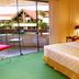 Yotau All Suites Hotel in Santa Cruz de la Sierra, guest room with balcony view and bedroom seating