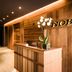 Nobu Hotel Marbella reception with wood-paneled front desk and staircase in Marbella