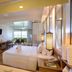 Katathani Phuket Beach Resort room with bathtub, king bed and balcony view in Karon