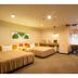 Nakamachi Fuji Grand Hotel Aizuwakamatsu twin room with two beds, desk, and warm lighting
