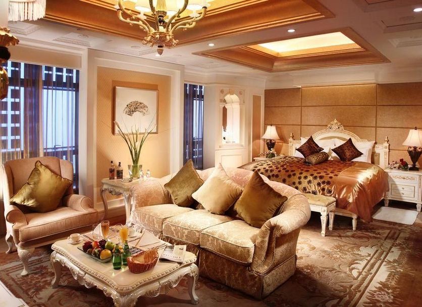 Power Valley International Hotel in Baoding, ornate guest room with sofa, king bed and chandelier