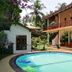 Haus Berlin in Bentota with a courtyard swimming pool and two-story balcony building