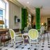 Hotel Romance Malesherbes by Patrick Hayat lounge in Paris with checkered floor, chairs and plants