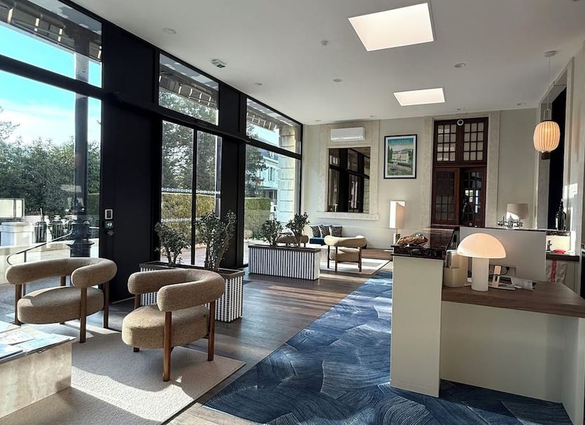 Hôtel des Eaux, Aix-les-Bains lobby with modern seating and large windows