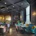 Minsk Marriott Hotel in Minsk lounge bar with teal seating, stools, and polished wood floors
