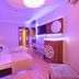 Grand Zaman Beach Hotel Alanya purple-lit twin room with TV and seating area